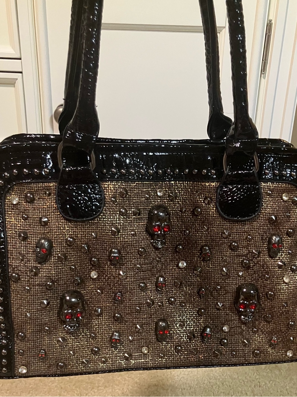 Black and Brown Studded Skull Tote Bag with Red Accent Eyes